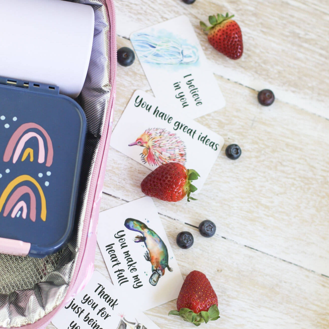 A set of affirmation cards spread out on a table