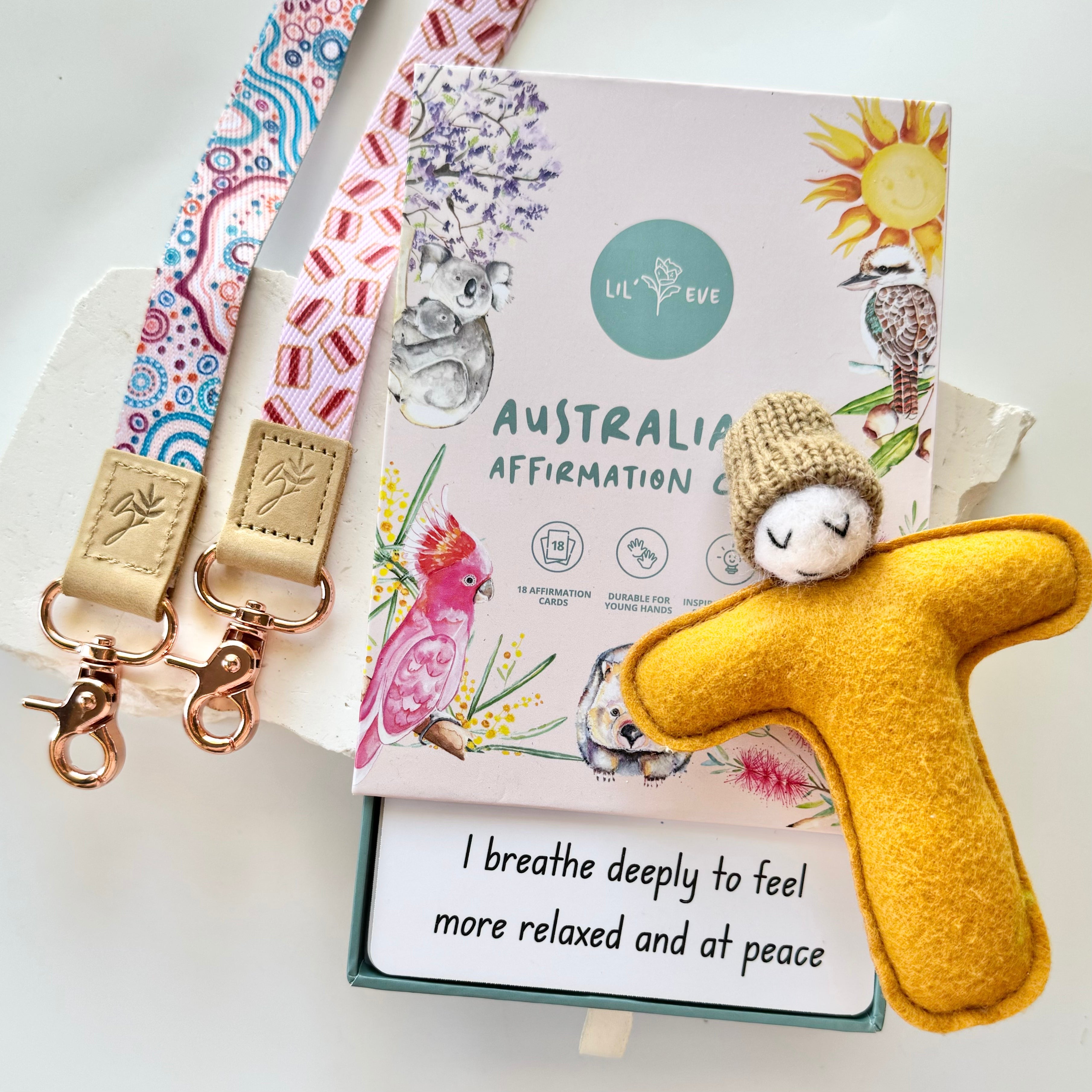 An a box of affirmation cards with a soft toy