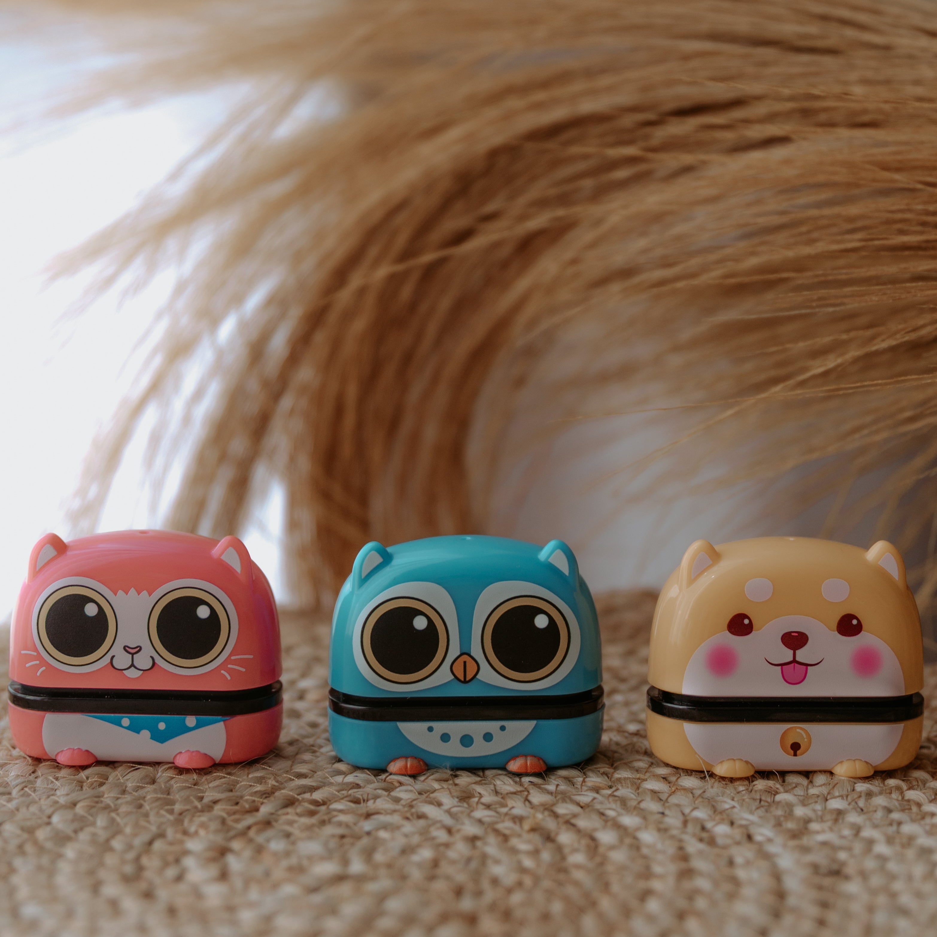 Three animal name stamps sit side by side each displaying characters, a cat, bird and dog