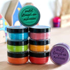 Multi coloured play dough in small containers